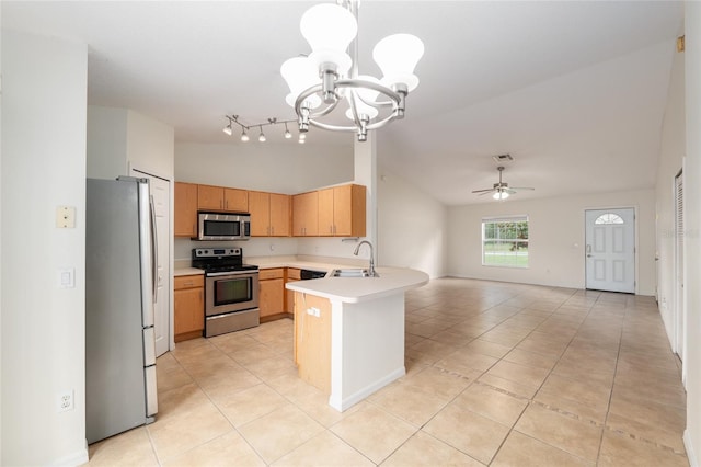 9 Hemlock Run, Ocala, FL 34472 - kitchen featuring appliances with stainless steel finishes, a chandelier, a peninsula, light tile patterned floors, and light countertops