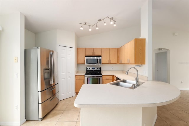 9 Hemlock Run, Ocala, FL 34472 - kitchen with appliances with stainless steel finishes, a peninsula, light tile patterned flooring, light countertops, and light brown cabinets
