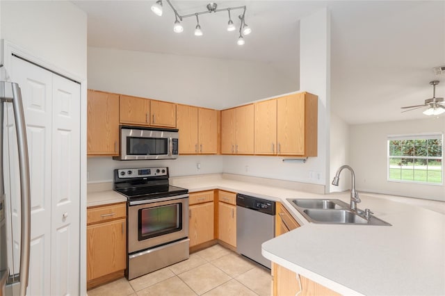 9 Hemlock Run, Ocala, FL 34472 - kitchen featuring appliances with stainless steel finishes, a peninsula, light countertops, light tile patterned floors, and a ceiling fan