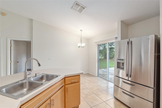 9 Hemlock Run, Ocala, FL 34472 - kitchen featuring stainless steel refrigerator with ice dispenser, a chandelier, light tile patterned flooring, and light countertops