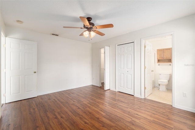 9 Hemlock Run, Ocala, FL 34472 - unfurnished bedroom featuring wood finished floors, a ceiling fan, ensuite bathroom, and a closet
