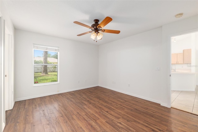 9 Hemlock Run, Ocala, FL 34472 - unfurnished bedroom with wood finished floors and a ceiling fan