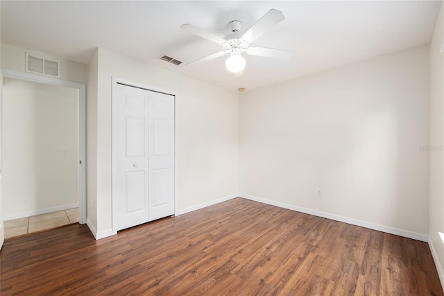 9 Hemlock Run, Ocala, FL 34472 - unfurnished bedroom featuring wood finished floors, a closet, and a ceiling fan