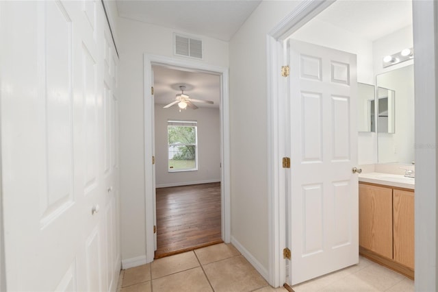 9 Hemlock Run, Ocala, FL 34472 - corridor with baseboards and light tile patterned floors