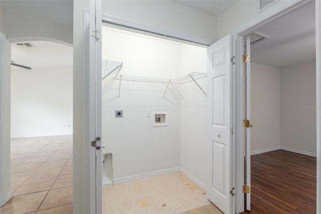 9 Hemlock Run, Ocala, FL 34472 - laundry room featuring hookup for an electric dryer, hookup for a washing machine, and arched walkways