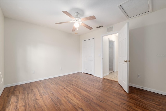 9 Hemlock Run, Ocala, FL 34472 - unfurnished bedroom featuring wood finished floors, attic access, and a ceiling fan