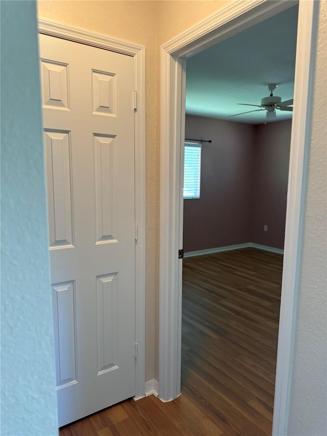 9090 SE 135th Loop, Summerfield, FL 34491 - hallway featuring dark wood-style floors and baseboards