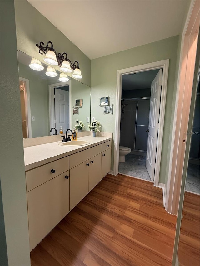 9090 SE 135th Loop, Summerfield, FL 34491 - full bathroom featuring wood finished floors, toilet, a shower stall, and vanity