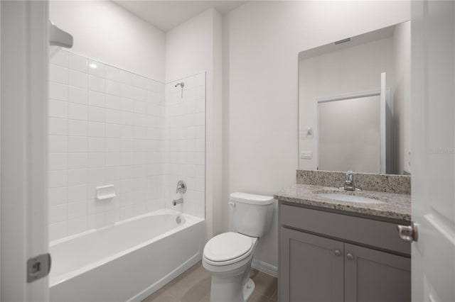 bathroom featuring tile patterned floors,  shower combination, toilet, baseboards, and vanity