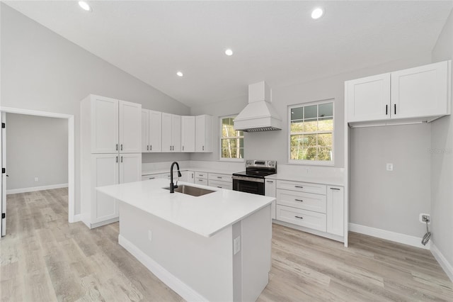 760 NE 152nd Ter, Williston, FL 32696 - kitchen with white cabinetry, electric range, custom range hood, and a sink