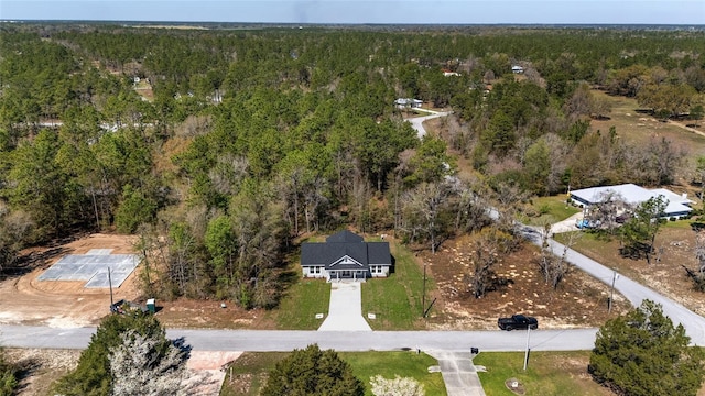 760 NE 152nd Ter, Williston, FL 32696 - birds eye view of property with a view of trees