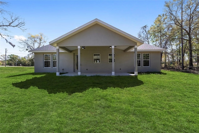 760 NE 152nd Ter, Williston, FL 32696 - rear view of house featuring a patio, a ceiling fan, a lawn, and stucco siding