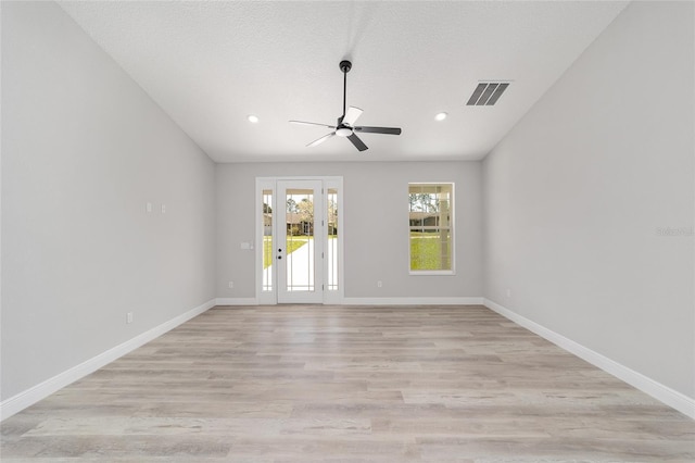 760 NE 152nd Ter, Williston, FL 32696 - spare room featuring light wood-type flooring, visible vents, baseboards, and ceiling fan
