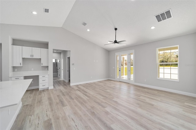 760 NE 152nd Ter, Williston, FL 32696 - unfurnished living room featuring visible vents, baseboards, light wood finished floors, lofted ceiling, and ceiling fan