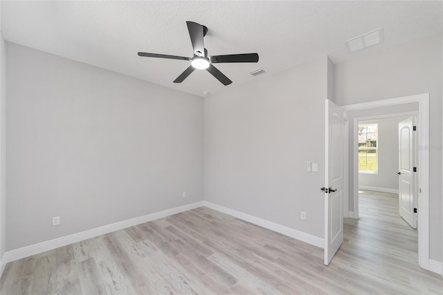 760 NE 152nd Ter, Williston, FL 32696 - unfurnished room featuring visible vents, baseboards, a ceiling fan, and light wood finished floors