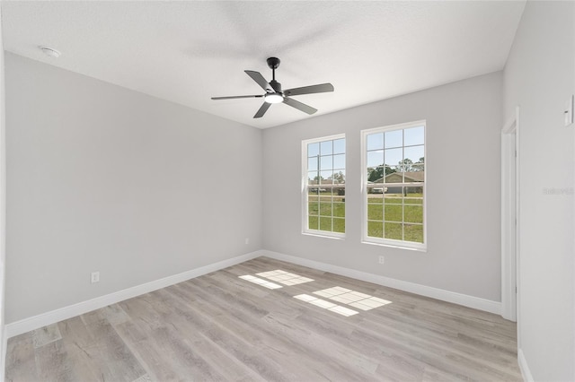 760 NE 152nd Ter, Williston, FL 32696 - empty room featuring baseboards, a textured ceiling, light wood-style flooring, and a ceiling fan
