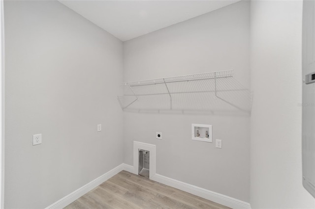 760 NE 152nd Ter, Williston, FL 32696 - laundry room with baseboards, light wood-type flooring, washer hookup, laundry area, and electric dryer hookup