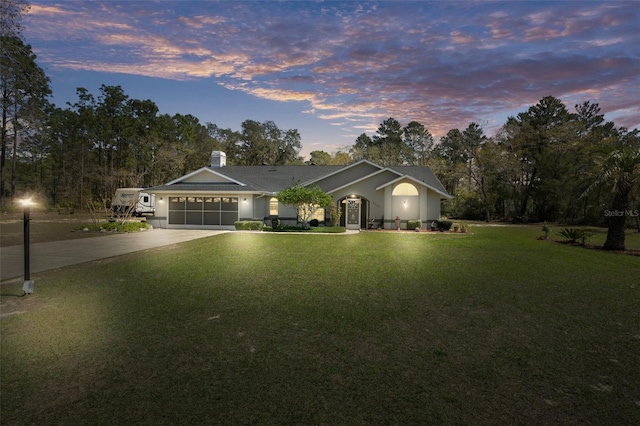 5557 N Sierra Ter, Beverly Hills, FL 34465 - ranch-style home featuring driveway, a garage, and a front lawn