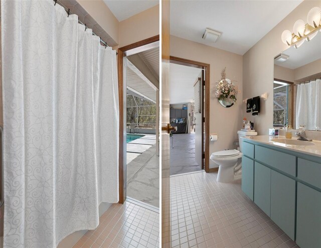 5557 N Sierra Ter, Beverly Hills, FL 34465 - bathroom with toilet, tile patterned flooring, a wealth of natural light, and vanity