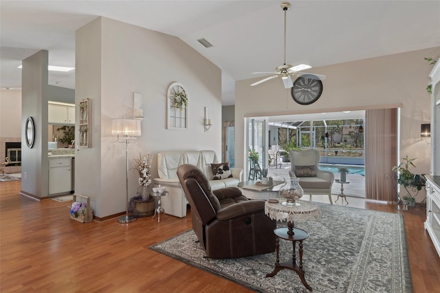5557 N Sierra Ter, Beverly Hills, FL 34465 - living area featuring wood finished floors, high vaulted ceiling, a ceiling fan, and visible vents
