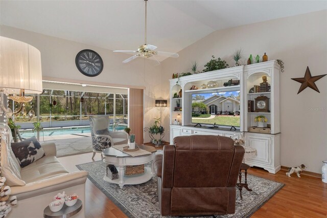 5557 N Sierra Ter, Beverly Hills, FL 34465 - living area featuring light wood-style flooring, ceiling fan, and vaulted ceiling