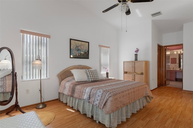 5557 N Sierra Ter, Beverly Hills, FL 34465 - bedroom with light wood-style floors, high vaulted ceiling, ensuite bath, and visible vents