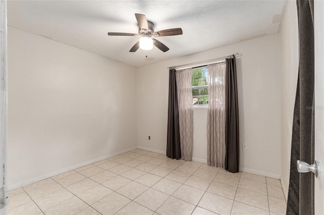 3910 SE 14th Ter, Gainesville, FL 32641 - empty room with a ceiling fan and light tile patterned floors