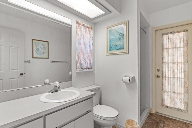 full bathroom featuring a shower, toilet, and vanity