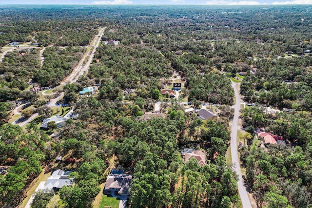 aerial view featuring a view of trees