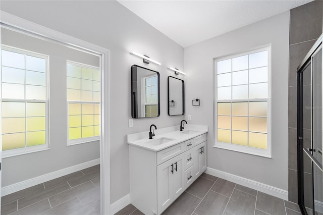 791 NE 150th Ave, Williston, FL 32696 - full bath featuring double vanity, baseboards, and a sink