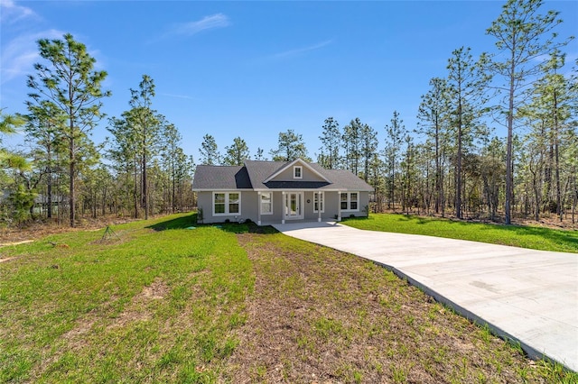 791 NE 150th Ave, Williston, FL 32696 - view of front of property featuring stucco siding, driveway, and a front lawn