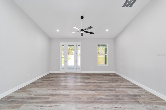 791 NE 150th Ave, Williston, FL 32696 - unfurnished room featuring visible vents, lofted ceiling, baseboards, and wood finished floors