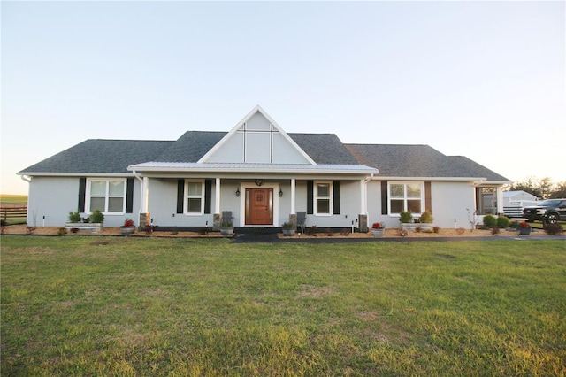 view of front of home featuring a front lawn and stucco siding