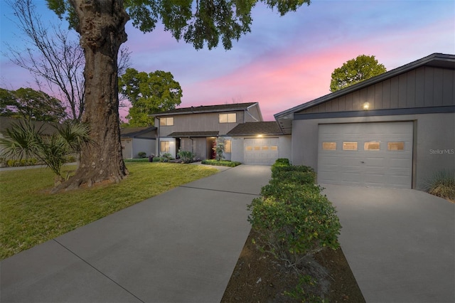 3870 NE 17th Street Cir, Ocala, FL 34470 - view of front facade with a lawn, driveway, and a garage