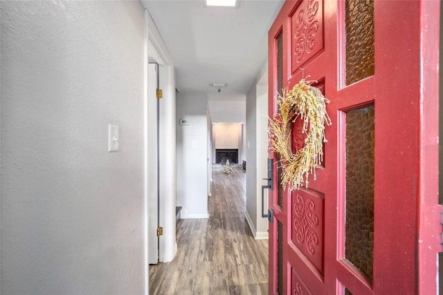 3870 NE 17th Street Cir, Ocala, FL 34470 - corridor with baseboards and wood finished floors