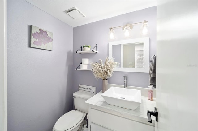 3870 NE 17th Street Cir, Ocala, FL 34470 - half bathroom with visible vents, toilet, and vanity