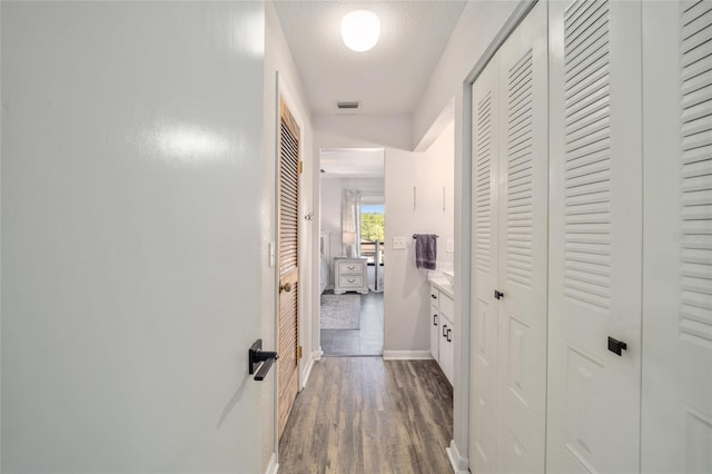 3870 NE 17th Street Cir, Ocala, FL 34470 - hall featuring dark wood-type flooring, baseboards, and visible vents