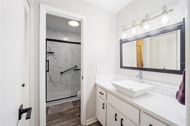 3870 NE 17th Street Cir, Ocala, FL 34470 - full bathroom featuring a closet, decorative backsplash, a marble finish shower, and toilet