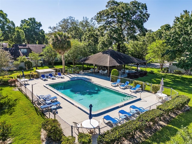 3870 NE 17th Street Cir, Ocala, FL 34470 - community pool featuring a yard, fence, and a patio area