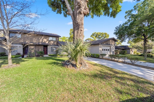 3870 NE 17th Street Cir, Ocala, FL 34470 - mid-century inspired home with a front yard, an attached garage, and concrete driveway