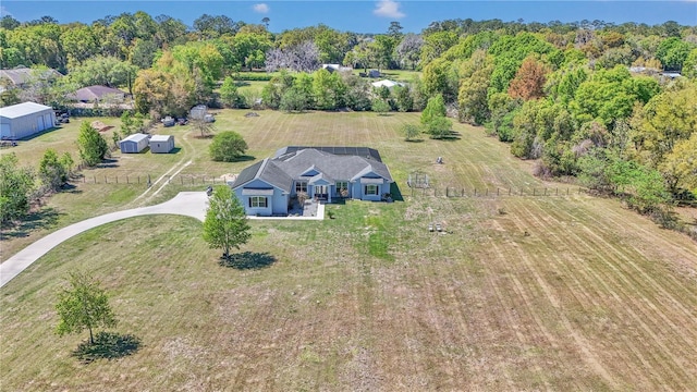 birds eye view of property featuring a rural view