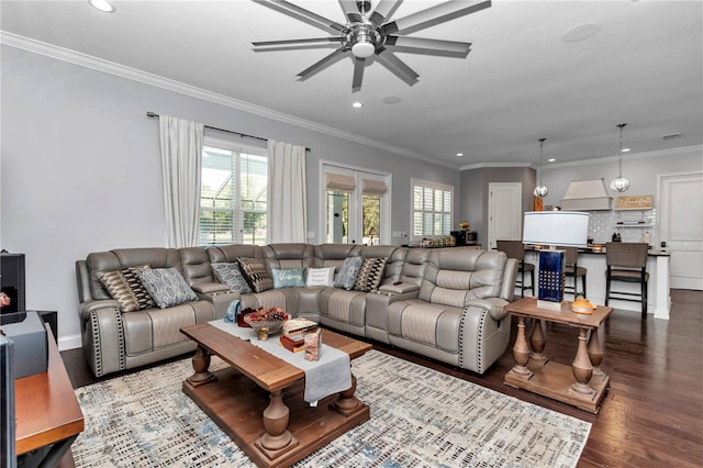 living room with wood finished floors, recessed lighting, ornamental molding, and ceiling fan
