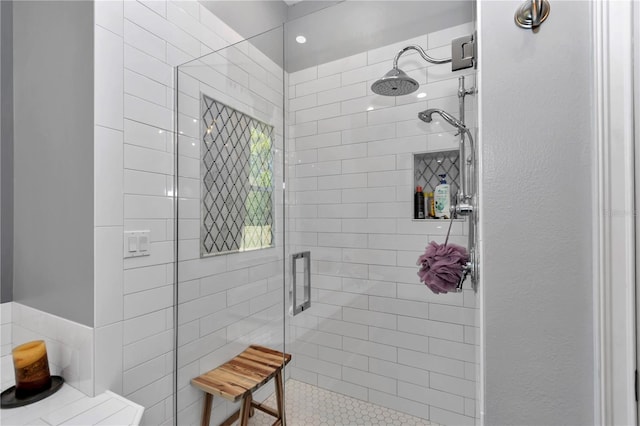 bathroom with tiled shower