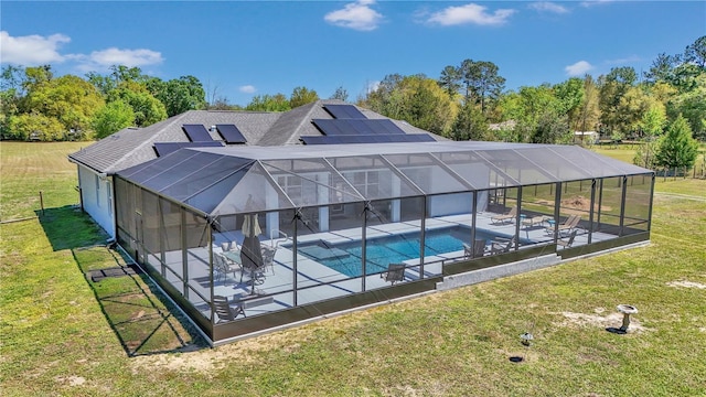 pool with a lanai, a yard, and a patio area