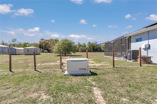 view of yard with fence and cooling unit