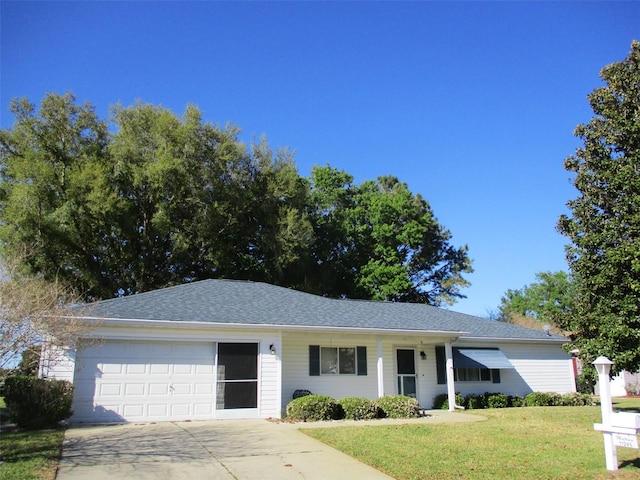 11245 SW 138th Ln, Dunnellon, FL 34432 - ranch-style house featuring a front yard, concrete driveway, a garage, and a shingled roof