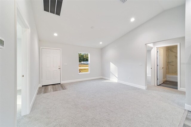15954 SW 30th Ln, Ocala, FL 34481 - empty room featuring visible vents, vaulted ceiling, recessed lighting, and carpet