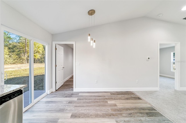 15954 SW 30th Ln, Ocala, FL 34481 - unfurnished dining area with baseboards, vaulted ceiling, visible vents, and light wood-style flooring