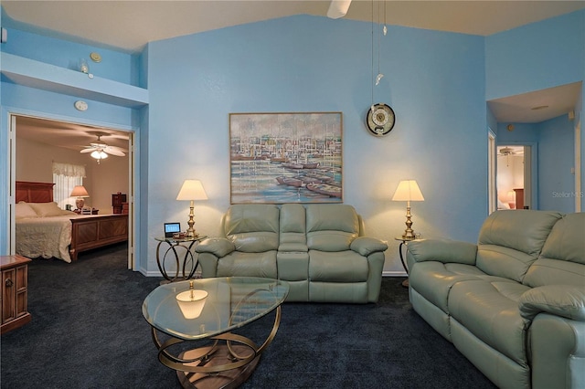 living room featuring baseboards, high vaulted ceiling, a ceiling fan, and dark colored carpet