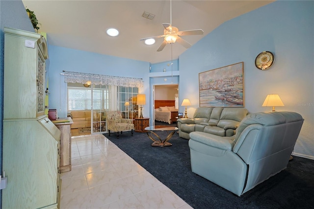 tiled living room with visible vents, high vaulted ceiling, and a ceiling fan